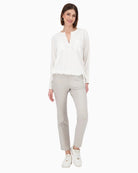 Model wearing Monari white blouse in regular fit paired with jeans