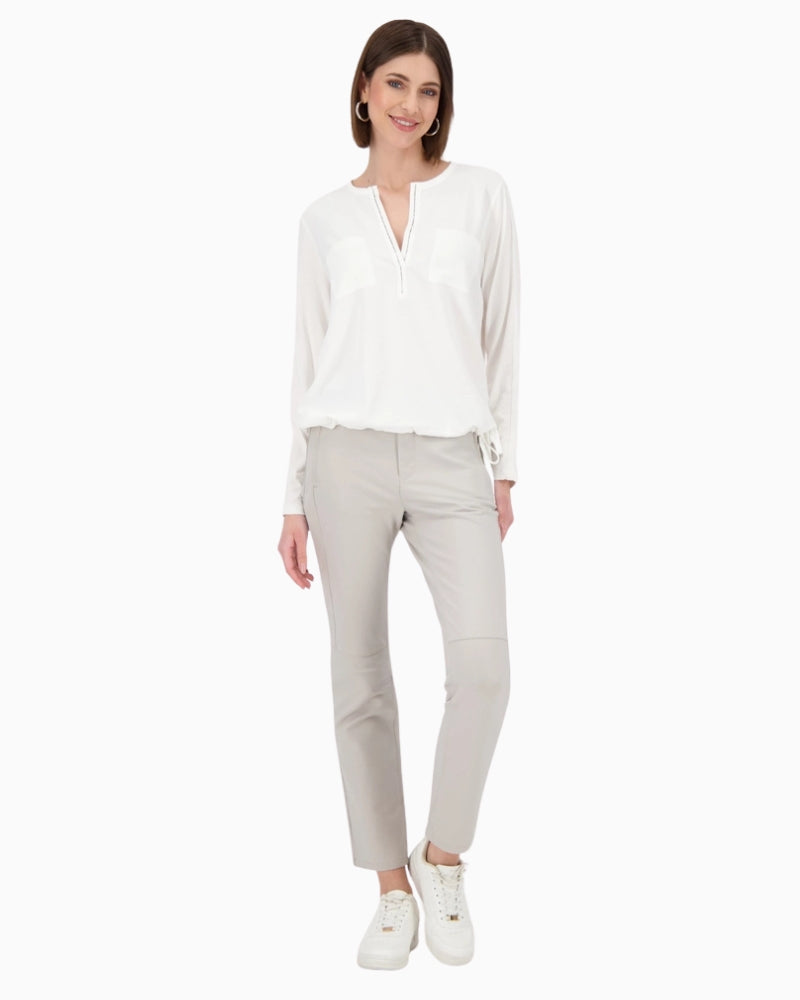 Model wearing Monari white blouse in regular fit paired with jeans