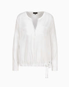Front pockets and satin finish on Monari white blouse