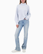 Monari knitted jumper with side slits side view showing stand-up collar on woman wearing it – Áines Boutique