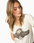 Close-up of hand-beaded sunburst detail on Mos Mosh cotton tee