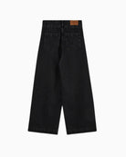 Back view of washed black drapy fit trousers