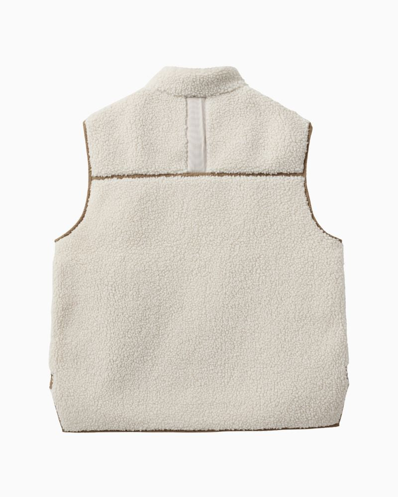 Back of Soft teddy fleece vest styled over chunky knitwear for autumn layering
