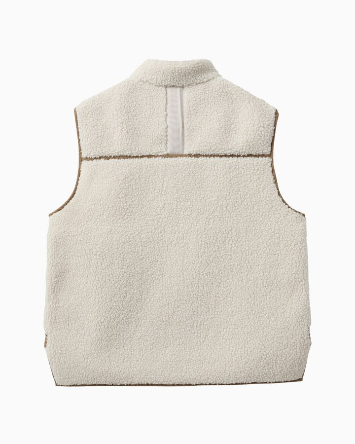Back of Soft teddy fleece vest styled over chunky knitwear for autumn layering