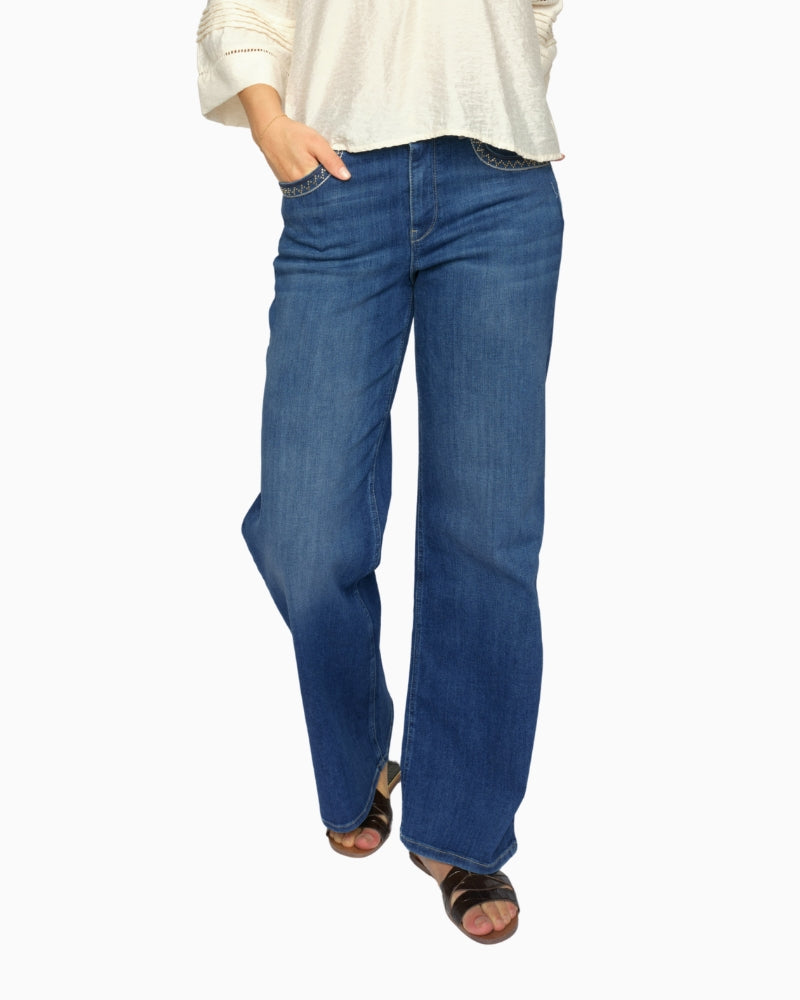 Woman wearing Mos Mosh flared stretch denim jeans, front view – Áines Boutique