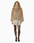 Model wearing Alexa jacket layered over jeans and boots