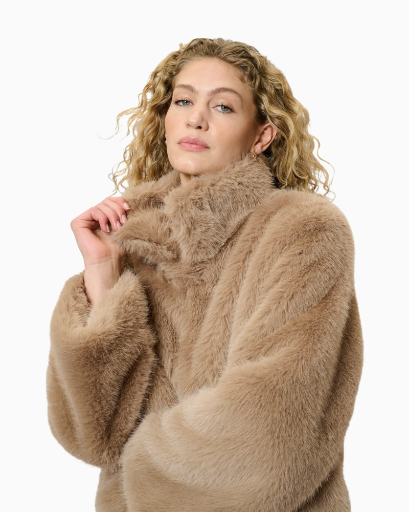 Detail of jacket sleeve and faux fur fabric texture