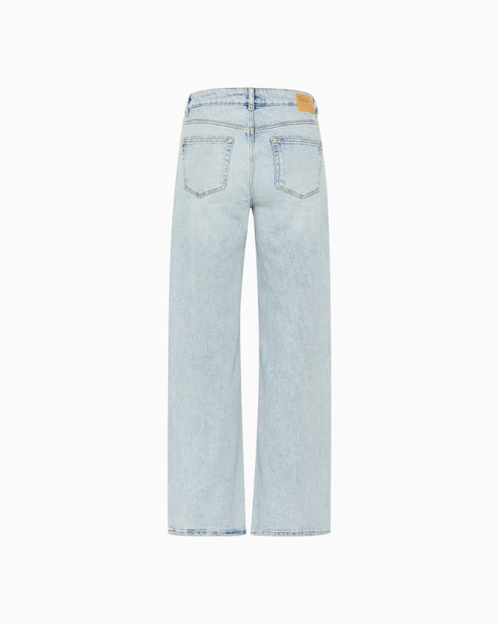 Back DangoMW jeans styled with tucked-in blouse and casual footwear