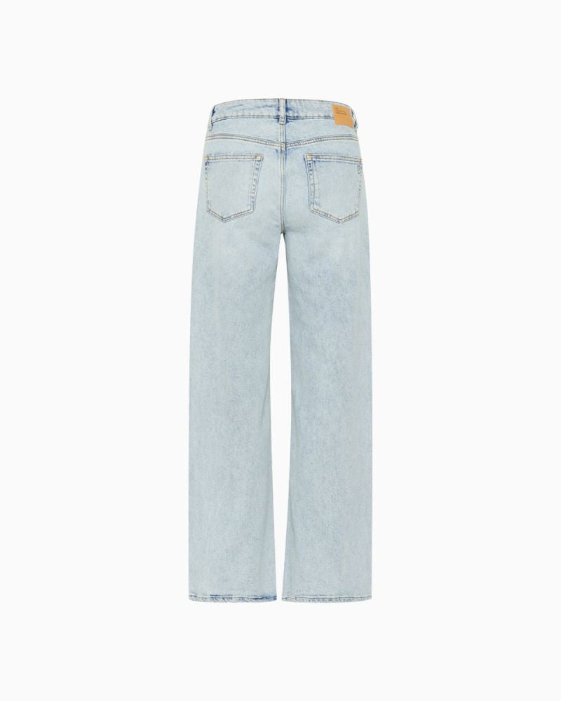 Back DangoMW jeans styled with tucked-in blouse and casual footwear