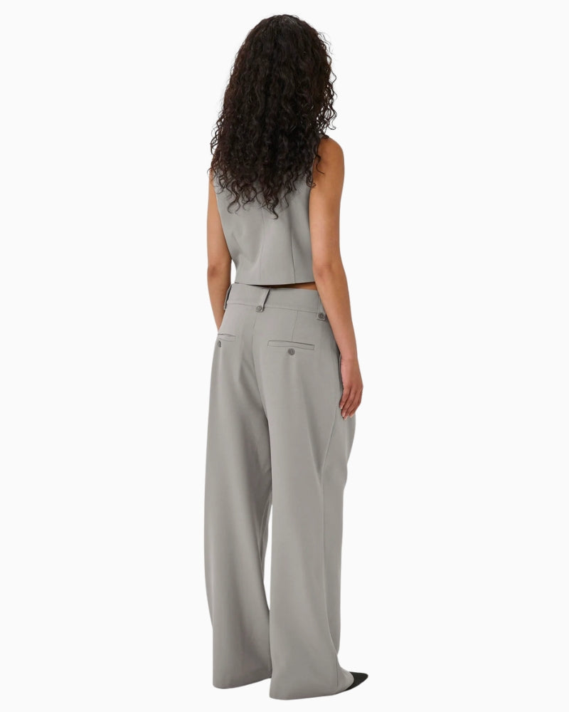 Back view showing tailored seams and relaxed leg shape