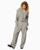 Model styling Disa vest with jeans and tee for smart casual look