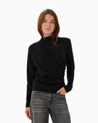 Black stretch blouse styled simply with jeans for a smart casual outfit