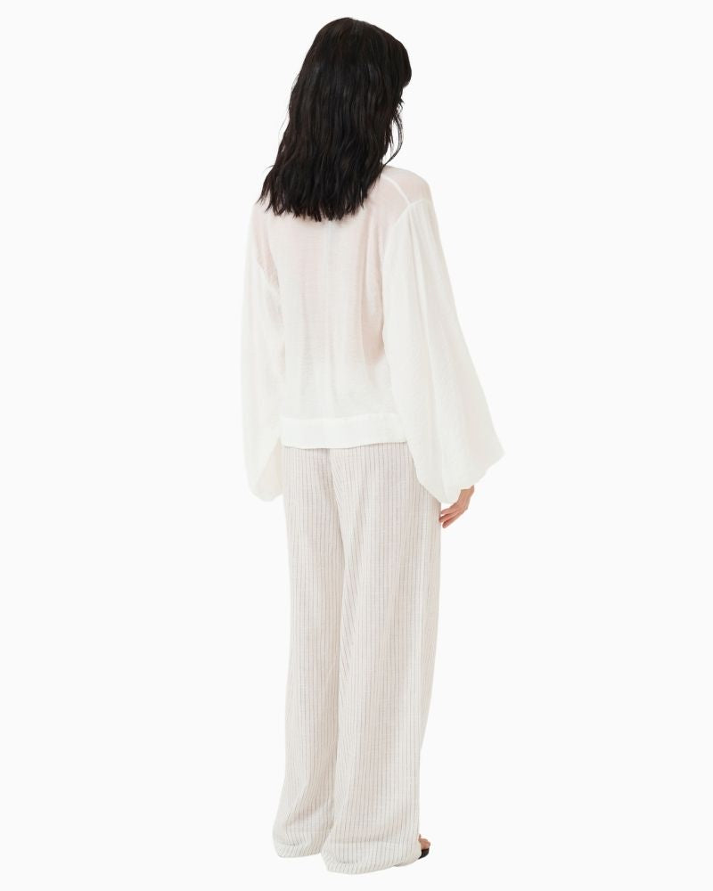 Back view of LiloMW relaxed fit blouse showing long sleeves and natural drape