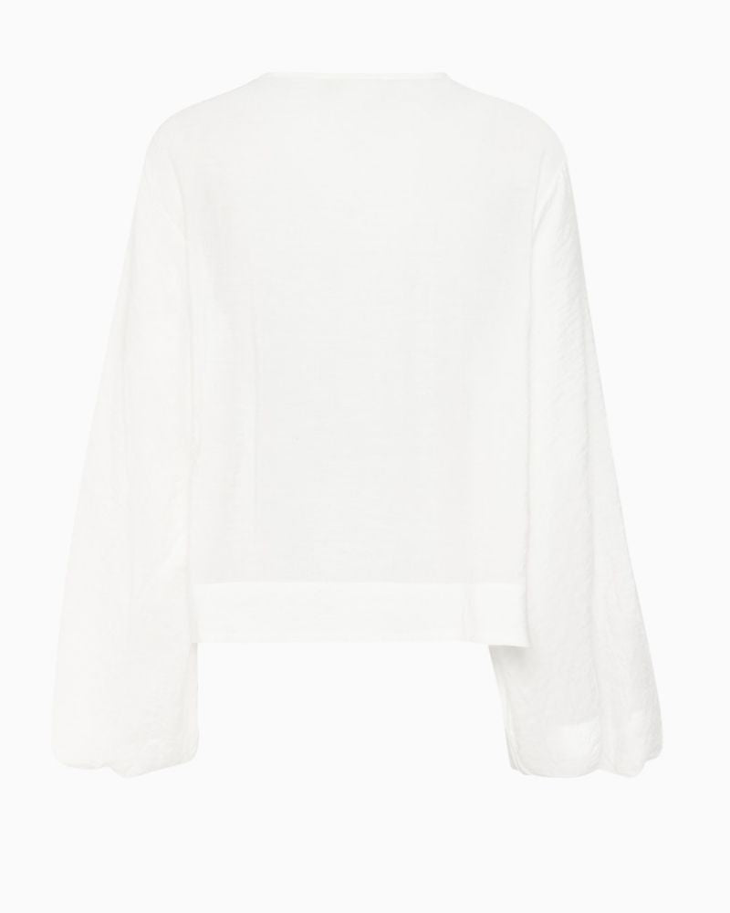 Back view of LiloMW relaxed fit blouse showing long sleeves and natural drape
