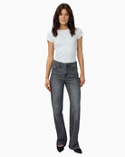 Full outfit styled with LOUIS jeans, white blouse and trainers for a casual daytime look