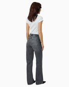 Back view of women's relaxed fit jeans with five-pocket design and full-length leg