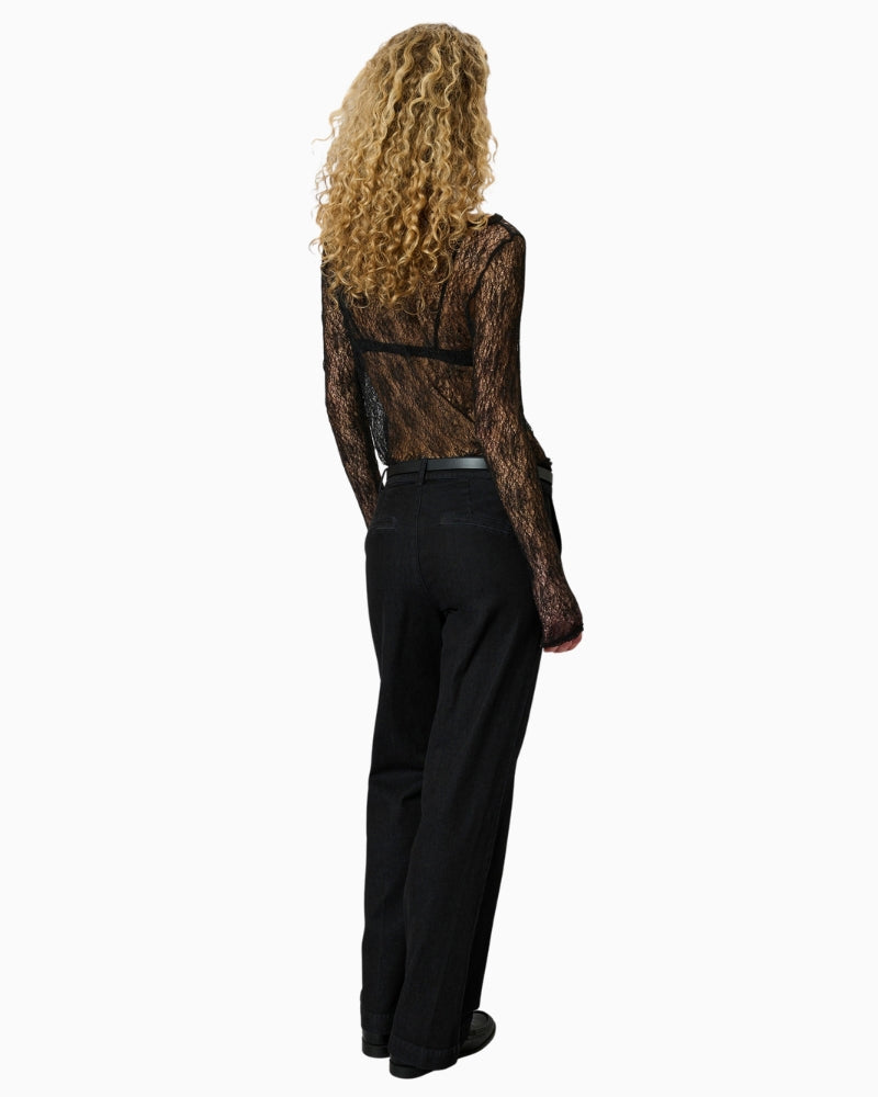 Back view of sheer black lace top with smooth, unlined finish