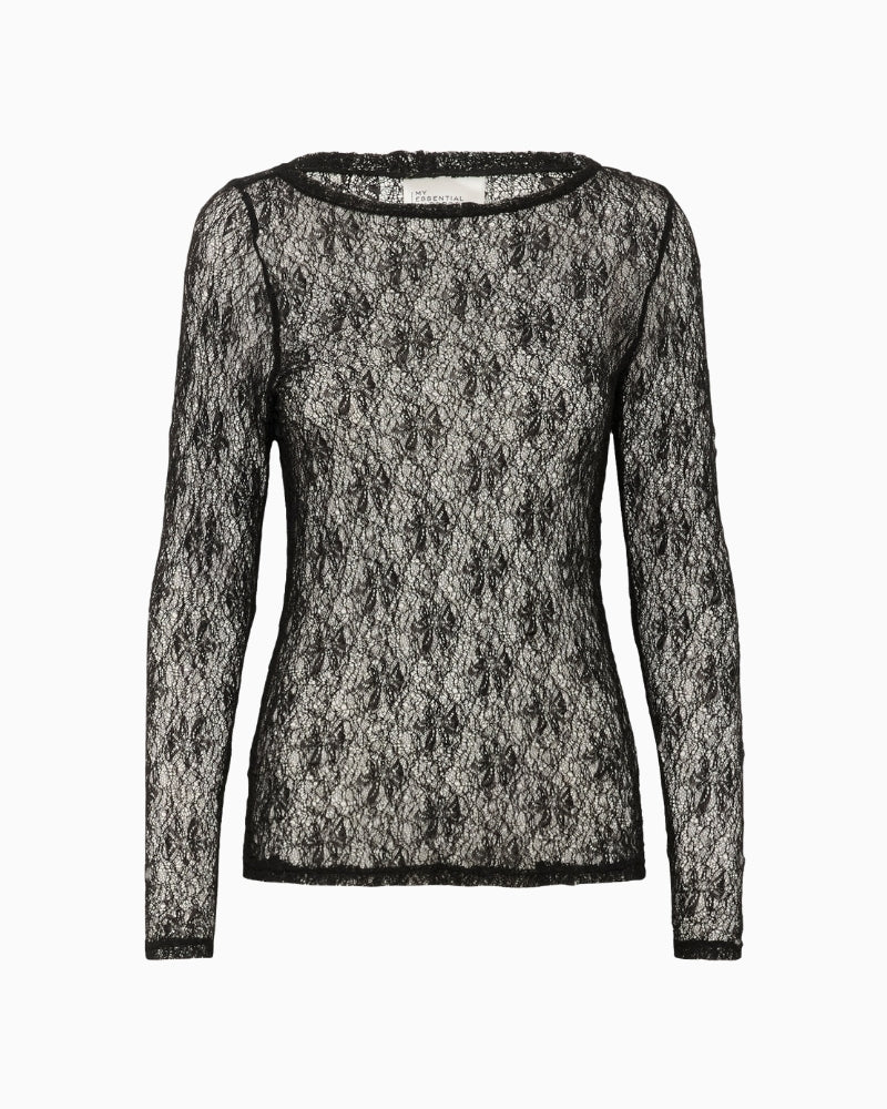 Front view of fitted lace top with round neckline and clean hem