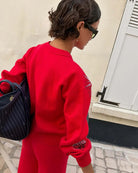 Never Fully Dressed Amore Forrest Cardigan in red back view