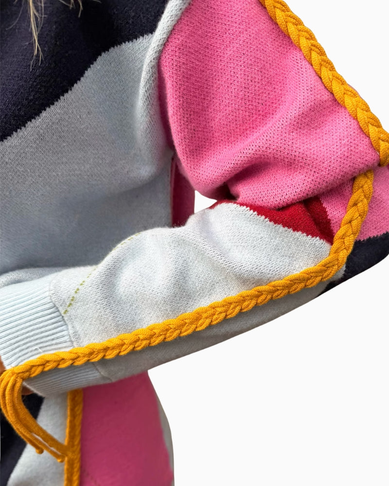 Never Fully Dressed Argyle Knit Jumper in Multi close-up of contrasting yellow braided sleeve detail