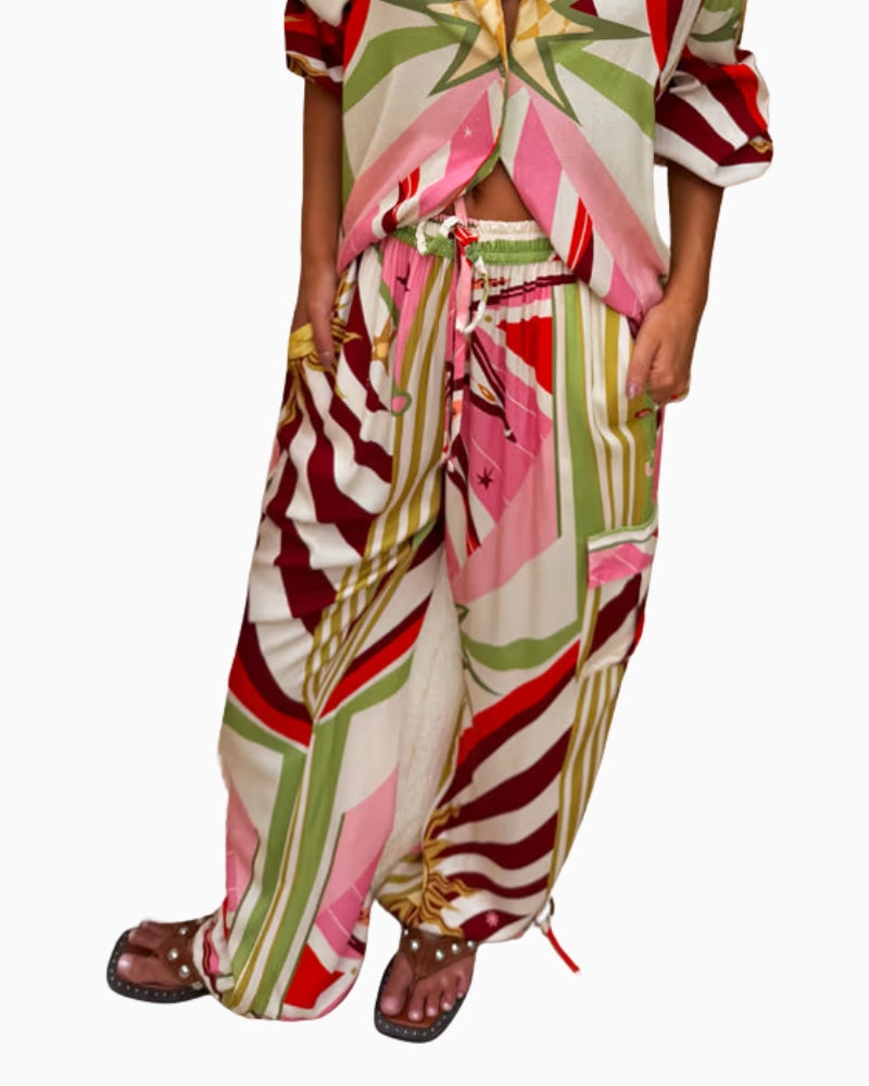 Never Fully Dressed Cirque Cargo Naomi Trousers with abstract print detail