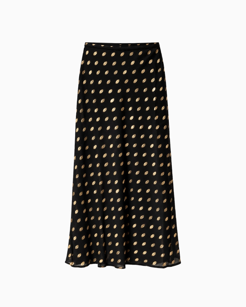 Never Fully Dressed Dorris Skirt in Black front view showing metallic gold polka dots and flowing maxi silhouette