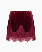 Never Fully Dressed Velvet Mini Maeva Skirt in Burgundy front view with floral lace hem