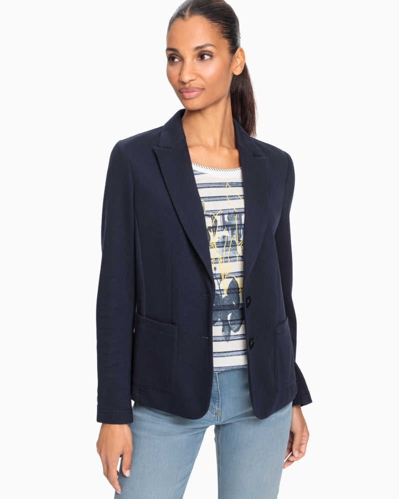Woman wearing Olsen navy blazer styled with jeans – Áines Boutique