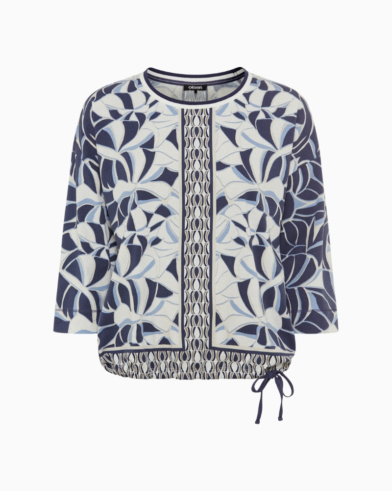 Front view of patterned navy 3/4 sleeve top with crew neck