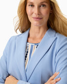 Woman wearing Olsen light blue blazer lapel and button detail – Áines Boutique