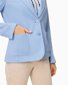 Woman wearing Olsen light blue blazer  button detail – Áines Boutique