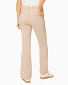 Woman wearing Olsen beige long denim trousers back view – Áines Boutique