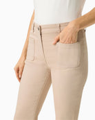 Woman wearing Olsen beige denim trousers side view – Áines Boutique