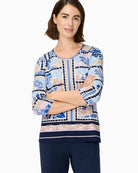 Woman wearing Olsen blue multi printed cotton top front view – Áines Boutique