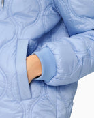 Woman wearing Olsen quilted jacket hood and zip detail – Áines Boutique