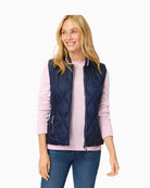Woman wearing Olsen navy quilted outdoor vest back view – Áines Boutique