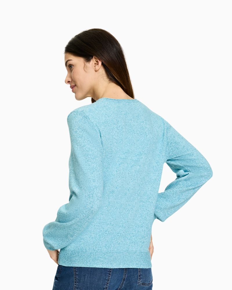 Teal long sleeve pullover styled with trousers – back view