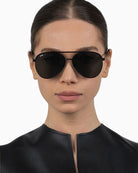 Otra Charlie sunglasses with matte black rounded aviator frame and smoke lenses