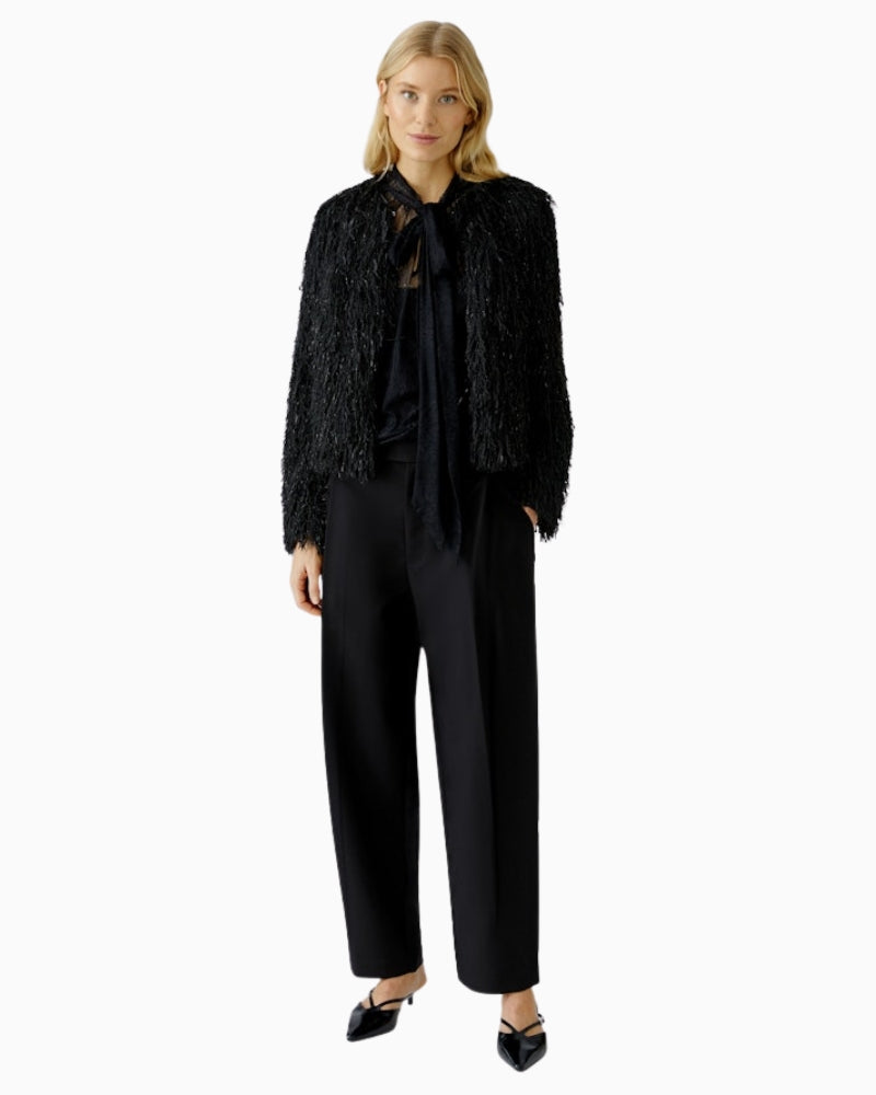 Oui black dressy jacket styled over a satin cami and tailored trousers