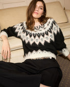 Oui black jumper styled casually with jeans and ankle boots