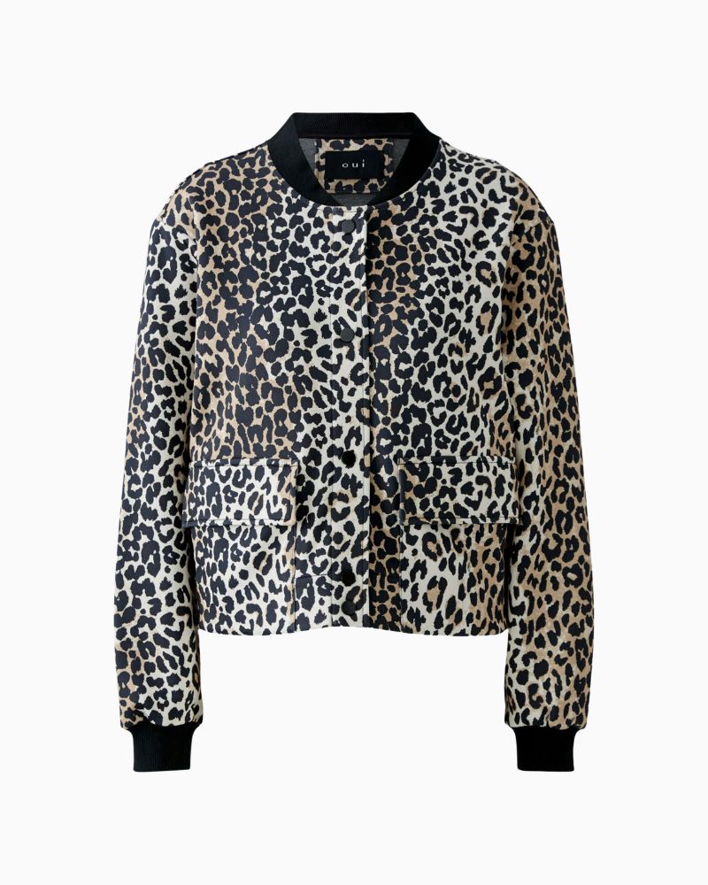 Front view of relaxed O-shape jacket showing stretch cuffs and soft scuba texture
