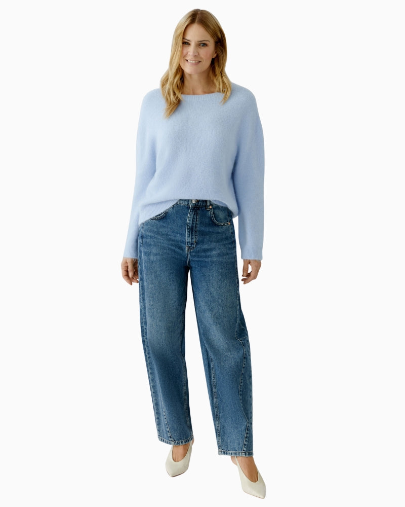 Oui blue pullover styled with light wash jeans for a casual look