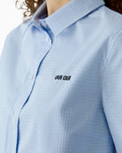 Close-up of Oui checked shirt blouse logo detail – Áines Boutique