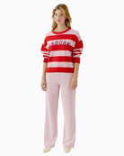 Model wearing mauve Oui trousers styled with knitwear