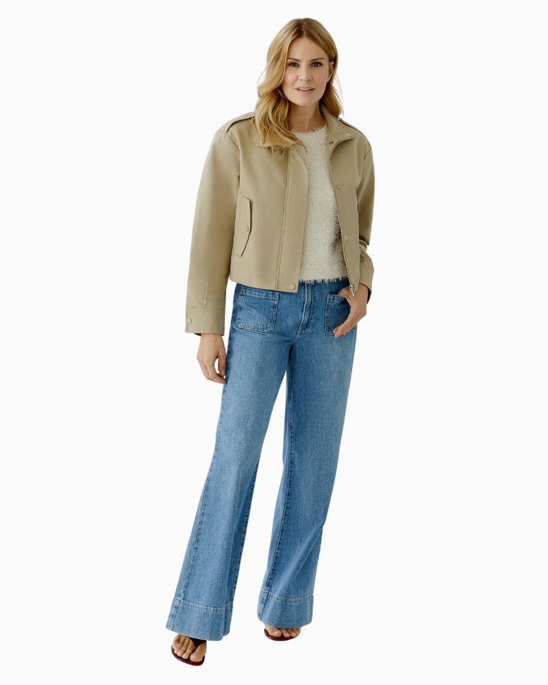 Woman wearing Oui sand jacket with denim, full outfit model view – Áines Boutique