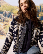 Front view of Oui dark blue blouse in ECOVERO viscose with ruffle neckline and elastic hem