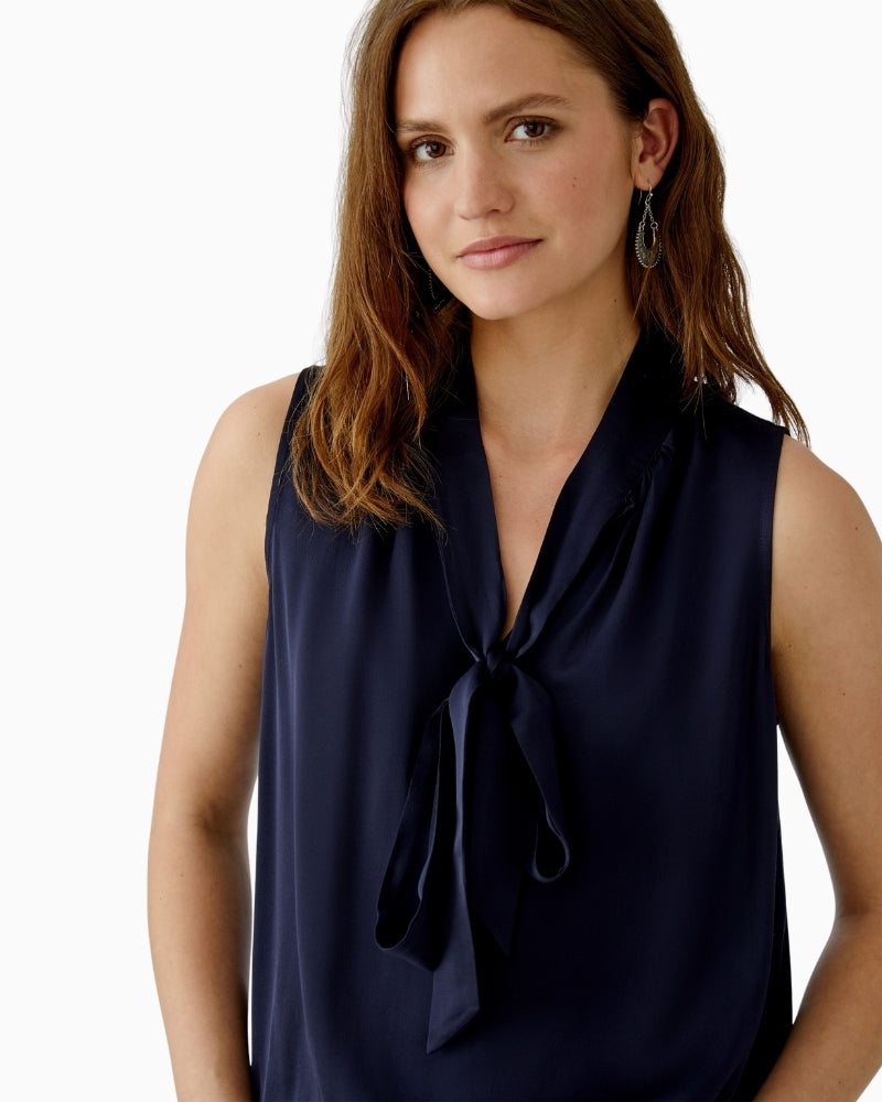 Close up view of Oui dark blue blouse in ECOVERO viscose with ruffle neckline and elastic hem