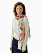 Woman wearing Oui rose red floral shawl draped over shoulders – Áines Boutique