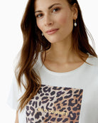 Close-up of raw edge sleeve and lightweight cotton texture