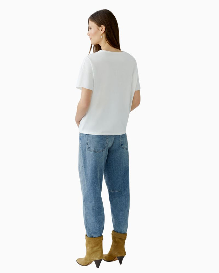 Back of oversized motif t-shirt with clean hemline and relaxed shape